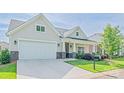 Lovely home with a two-car garage, manicured lawn, and covered front porch at 1109 Bunch Dr, Statesville, NC 28677