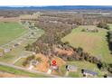 Scenic aerial view of a charming home nestled in a lush landscape with distant mountain views at 1244 Bob Falls Rd, Shelby, NC 28150