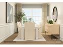 Elegant dining room with wainscoting and large window, perfect for hosting gatherings at 1541 Croydon St, Indian Land, SC 29707