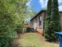 Image showcasing the side yard of the property and the home's exterior and AC unit at 157 5Th N Ave, Taylorsville, NC 28681