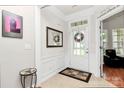 Inviting foyer with tile flooring, neutral paint, and decorative wall trim provides a warm welcome at 19106 Mallard Dr # 216, Fort Mill, SC 29707