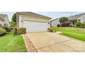 Spacious two-car garage and wide driveway offers convenience, additional parking, and compliments the exterior at 19106 Mallard Dr # 216, Fort Mill, SC 29707