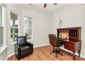 Sunlit office with wood floors, two windows, and a stylish desk creates a productive workspace at 19106 Mallard Dr # 216, Fort Mill, SC 29707