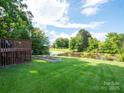 Scenic pond view from the backyard with a deck, offering a tranquil outdoor space at 1918 Gables Dr, Monroe, NC 28112