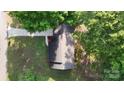An aerial view showcasing the home's roof and surrounding trees and landscape at 2026 Willow Ridge St, Conover, NC 28613