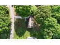 Aerial view of a well-maintained home and backyard surrounded by trees at 2026 Willow Ridge St, Conover, NC 28613