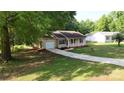 Charming one-story home with a well-manicured lawn and inviting driveway at 2026 Willow Ridge St, Conover, NC 28613