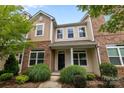 Inviting townhome with brick accents and well-maintained front yard landscaping at 206 Overstone Ct, Fort Mill, SC 29715