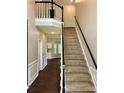 Grand foyer with staircase, dark wood flooring, and natural light flooding the home at 4504 Bellmore Ct, Charlotte, NC 28269