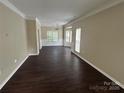 Spacious living room featuring beautiful hardwood floors and plenty of natural light at 4504 Bellmore Ct, Charlotte, NC 28269