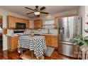Bright kitchen featuring stainless steel appliances, wooden cabinets and an island at 7007 Broad Leaf Ct, Indian Trail, NC 28079