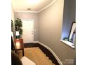 Bright entryway featuring hardwood floors, a stylish rug, and decorative accents at 1000 E Woodlawn Rd # 107, Charlotte, NC 28209