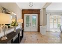 Inviting foyer with tiled floors, elegant doors, and stylish decor at 14515 Nolen Ln, Charlotte, NC 28277
