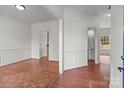 The spacious living room has a parquet floor, white walls, and decorative molding at 1534 Piney Church Rd, Concord, NC 28025