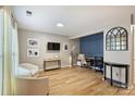 Bright living area features modern lighting, neutral walls, durable flooring, and ample seating at 15639 Sir Charles Pl, Charlotte, NC 28277