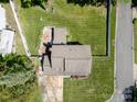 Aerial view showcases the backyard, roof, and surrounding landscape of the property at 2008 Bantry Ln, Charlotte, NC 28262