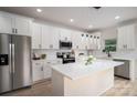 Bright kitchen with white cabinets, stainless steel appliances, and stylish pendant lighting at 207 9Th Ne Ct, Conover, NC 28613