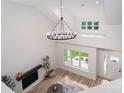 Bright, open living area featuring a fireplace, large windows, and modern decor at 207 9Th Ne Ct, Conover, NC 28613