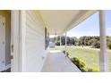 A cozy covered porch with decorative pillars, perfect for enjoying the outdoors at 2377 Mintew Cir, Lincolnton, NC 28092