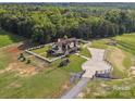 Scenic aerial view showcases the property's sprawling land, fencing, and private driveway at 2521 Neely Store Rd, Rock Hill, SC 29730