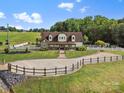 Picturesque property featuring a well-manicured lawn, gated entrance, and a charming home at 2521 Neely Store Rd, Rock Hill, SC 29730