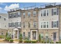 Beautiful brick townhomes with rooftop patio and manicured landscaping at 310 N Dotger N Ave # 4, Charlotte, NC 28204