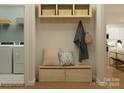 Organized mudroom with storage bench, hooks, and overhead baskets perfect for coats, bags, and shoes at 3882 Horsham St, Indian Land, SC 29707