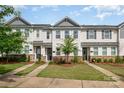 Attractive townhomes boast stone accents, vinyl siding, manicured lawns and inviting curb appeal at 4117 Galloway Park Dr, Charlotte, NC 28262
