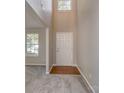 Inviting foyer with hardwood flooring at the entrance and a view of the upper level at 4208 Everest Dr, Gastonia, NC 28054