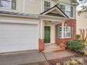 Close-up of the home's entrance highlighting the green door and brick accents at 4208 Everest Dr, Gastonia, NC 28054