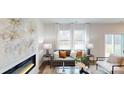 Well-lit living room with comfortable seating and an elegant fireplace at 5058 Beargrass Dr, Dallas, NC 28034