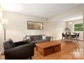 Bright living room featuring hardwood floors, modern furnishings, and ample natural light at 5604 Bethesda Ct, Charlotte, NC 28226