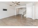 Bright, open living room features hardwood floors and a ceiling fan, showcasing a modern and airy space at 829 River Park Rd, Belmont, NC 28012