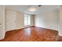 Bright living room featuring pristine walls, hardwood floors, and a large window at 275 N Garrison Rd, Rock Hill, SC 29730