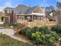 Multi-level wooden deck perfect for outdoor entertaining and enjoying the backyard at 3115 Duck Point Dr, Monroe, NC 28110