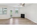 Bright living room with fireplace and access to a backyard view at 5254 Spanish Ivy Ln # 133, Indian Land, SC 29707