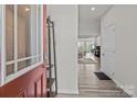 Bright entryway featuring hardwood floors and a view into the open-concept living space at 5625 Axil Ln, Charlotte, NC 28269