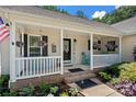 Inviting front porch with comfortable seating and decorative details, creating a welcoming entrance to the home at 5764 Grassy Creek Rd, Denver, NC 28037