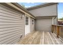 Wooden back porch featuring neutral siding and a view of the outdoor area at 60 Valley Nw St, Concord, NC 28025