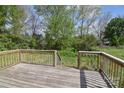 Wooden deck with railings overlooking green backyard at 6124 Old Mt Holly Rd, Charlotte, NC 28208