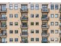 Building exterior with multiple balconies, windows and neutral color palette at 715 N Church St # 613, Charlotte, NC 28202