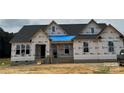 New home construction shows framing and building wrap ready for finishing touches at 7517 Lancaster Hwy # 5, Waxhaw, NC 28173