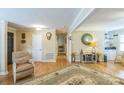 Inviting living room with wood floors, decorative rug, and access to multiple rooms at 814 Rhodann Dr, Shelby, NC 28152