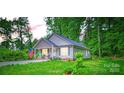 Well-maintained single Gathering home with lush green lawn at 105 W 17Th St, Salisbury, NC 28144