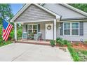 Close-up of a cozy front porch with rocking chairs and a welcoming entrance at 105 W 17Th St, Salisbury, NC 28144