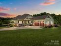 Charming single-Gathering home with a well-manicured lawn and a three-car garage at 1115 Wynnbrook Way, Concord, NC 28027