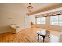 Bright and airy living room featuring hardwood floors, chandelier, and ample natural light at 1184 Cambridge Dr, Shelby, NC 28152