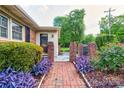 Inviting brick walkway leading to the front door, framed by lush greenery and brick columns at 1184 Cambridge Dr, Shelby, NC 28152
