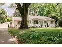 Traditional-style home boasts mature trees and landscaping at 1184 Thornwell Ave, Rock Hill, SC 29732