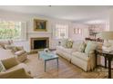Bright living room features a cozy fireplace, neutral tones, and ample seating at 1184 Thornwell Ave, Rock Hill, SC 29732